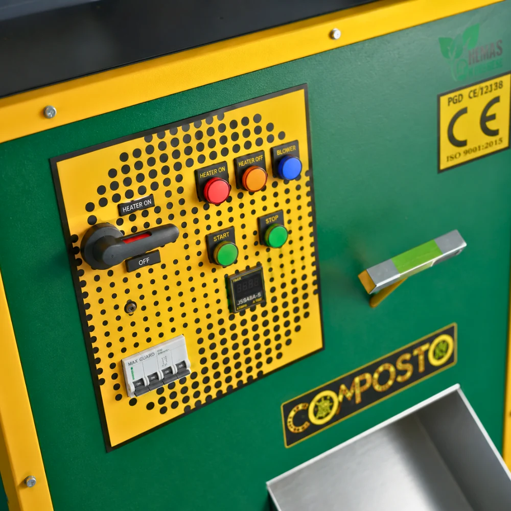 Close-up of COMPOSTO VEER PLC control panel with heater, blower, start and stop controls and MCB protection